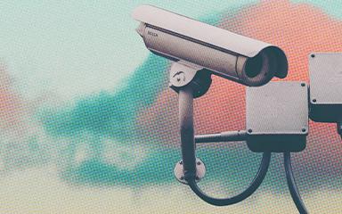 Outdoor security camera with teal and salmon clouds